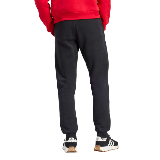 Manchester United FC Essentials Trefoil Tracksuit Pants 2023/24 | EvangelistaSports.com | Canada's Premiere Soccer Store