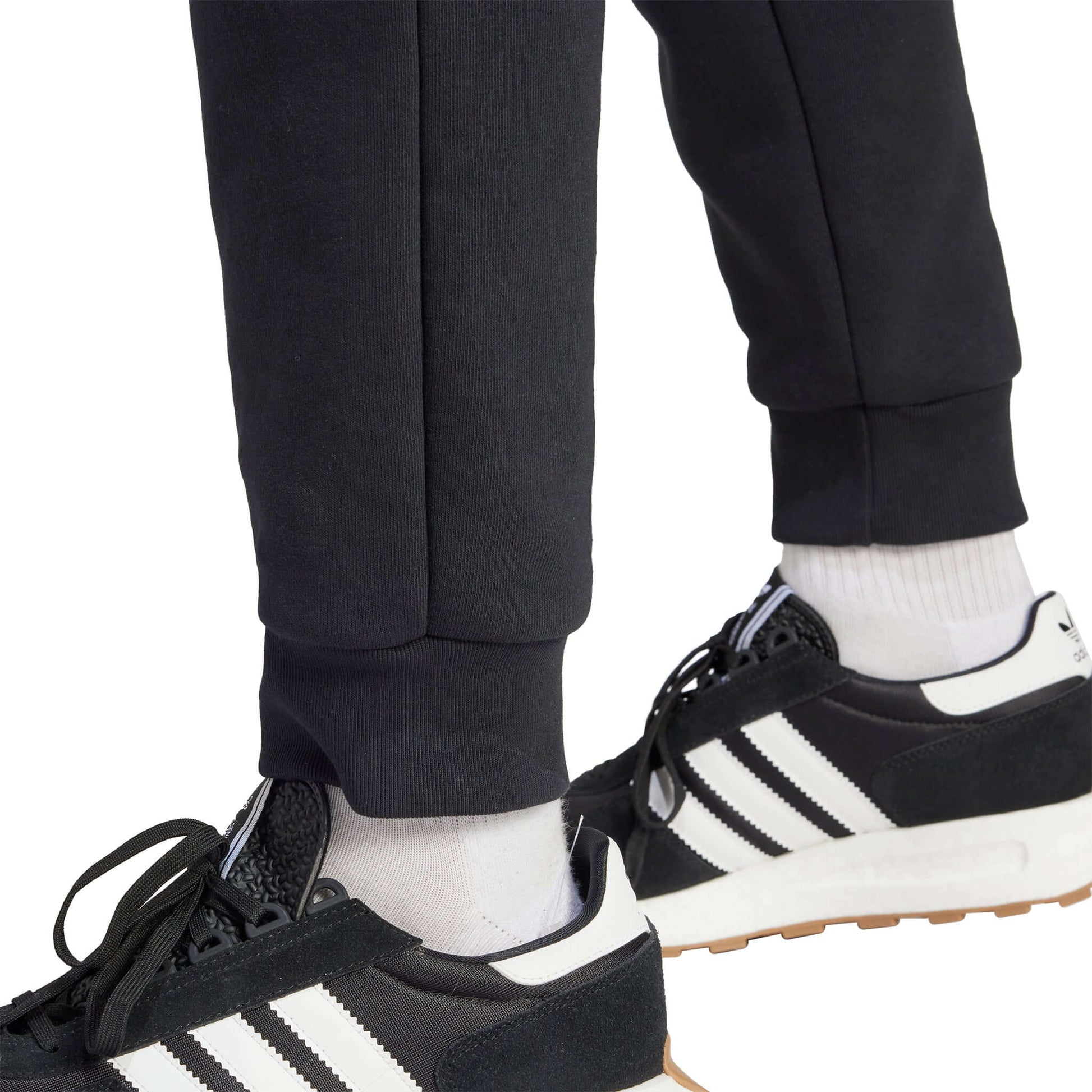 Manchester United FC Essentials Trefoil Tracksuit Pants 2023/24 | EvangelistaSports.com | Canada's Premiere Soccer Store